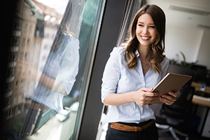 Woman holding a tablet computer.