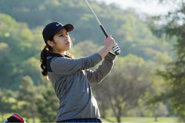 Photo of female golfer.