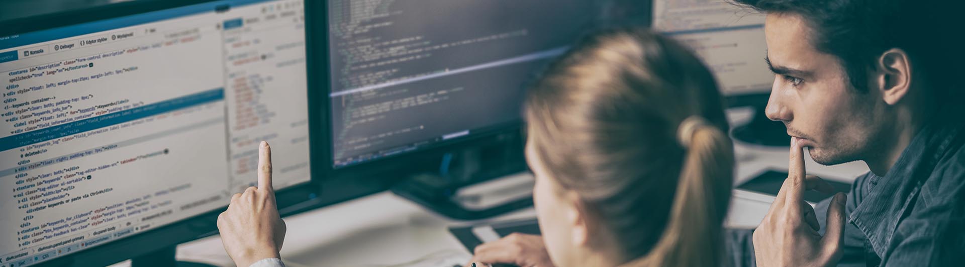 people looking at a computer