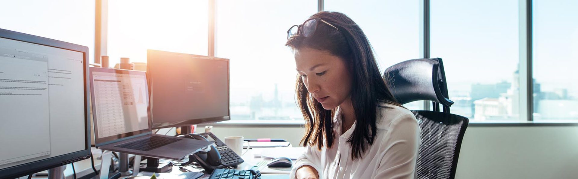 woman doing work at her desk