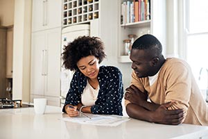 military family at home working on paperwork