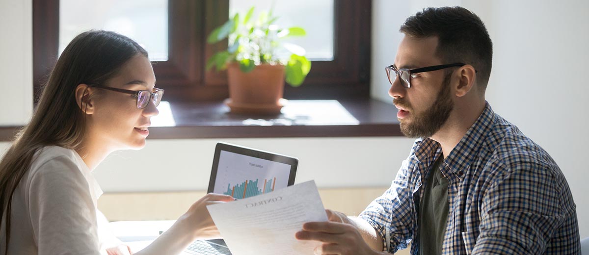 Couple reviewing debts