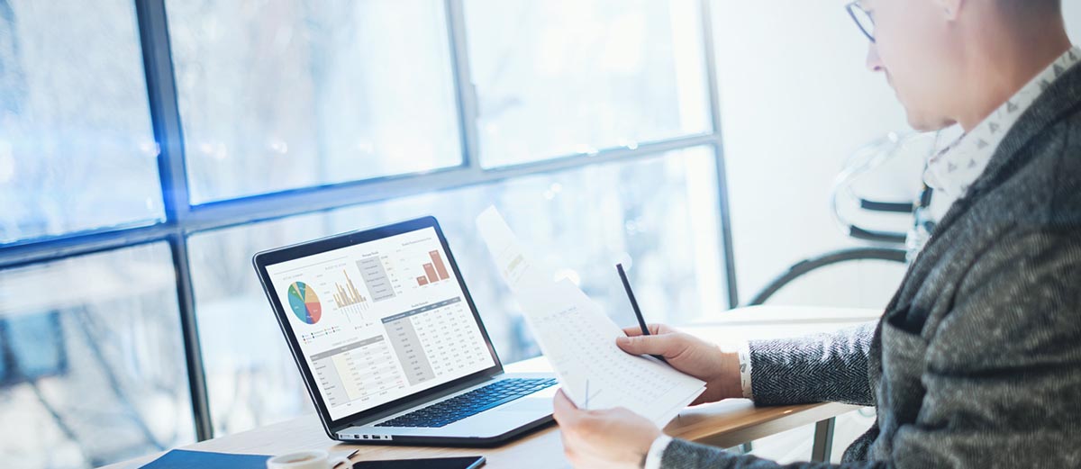 man looking at computer