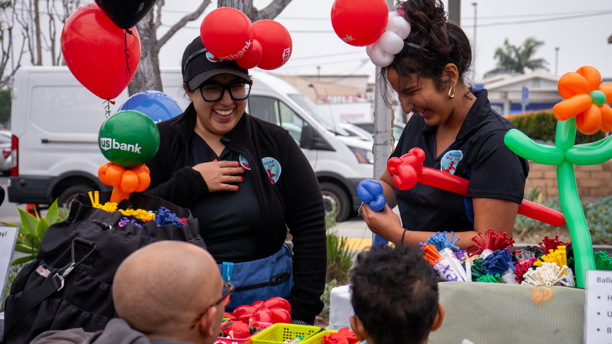 Women making balloon animals