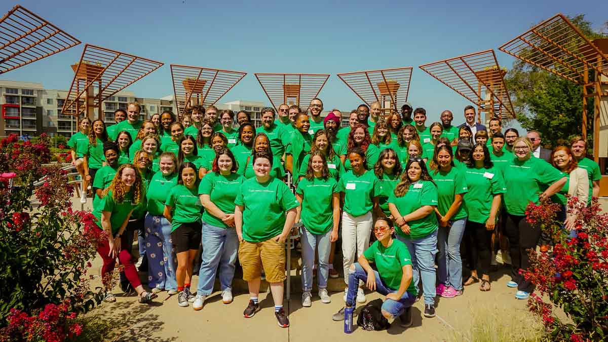 Group of people in green shirts