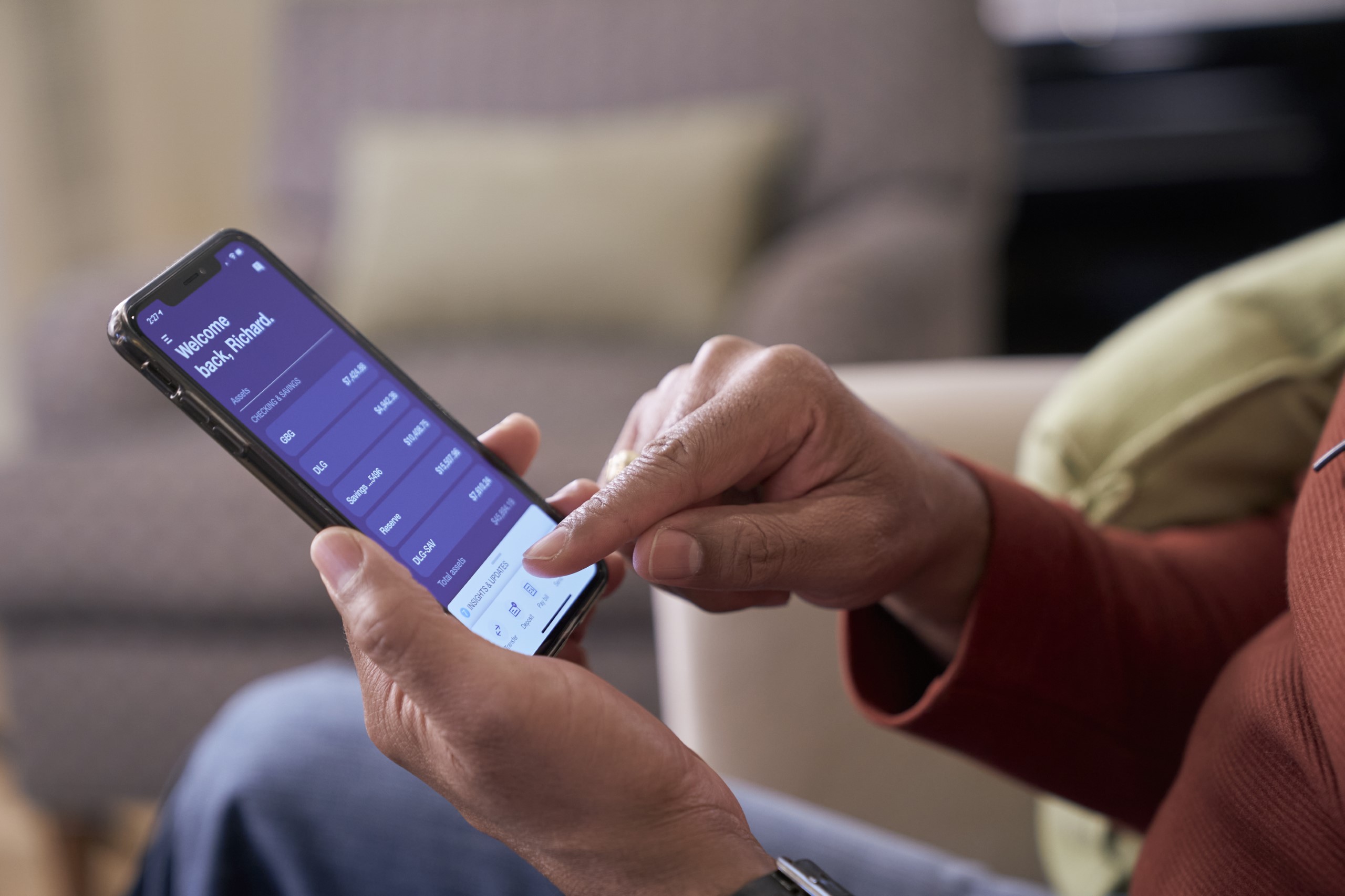 Close up of the U.S. Bank Mobile App with a person using their phone