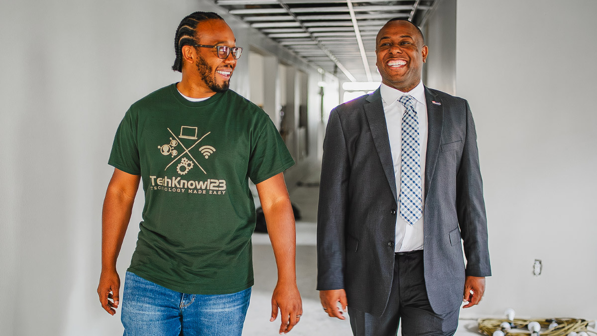 Two men walking together.