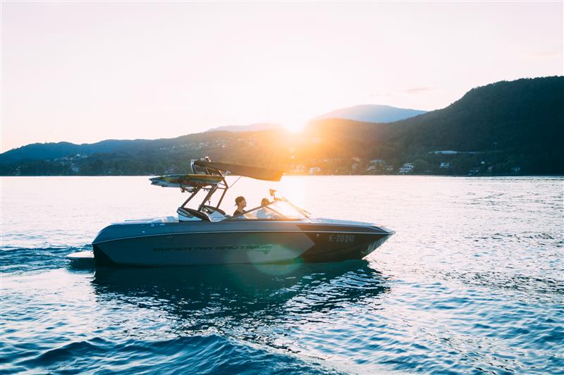 Couple driving a boat on a lake