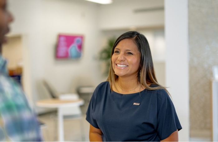 U.S. Bank Business Access Advisor (BAA) Chio Scott smiles at client.