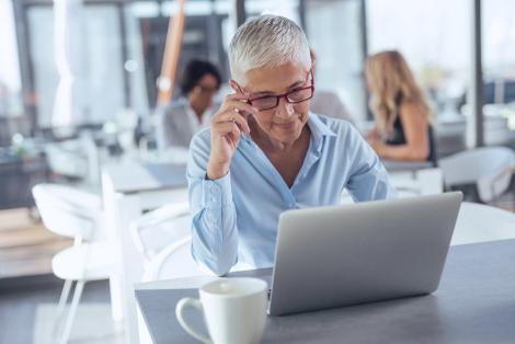 Woman reviewing retirement strategies on a laptop