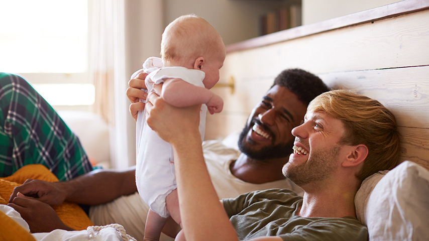 Men smiling after reviewing Retirement Money Market Account information