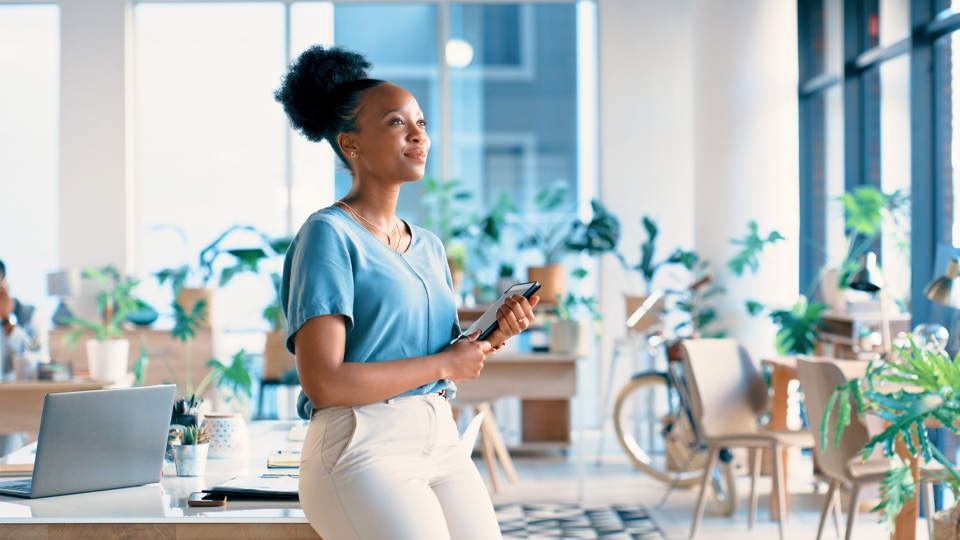 Woman creative and thinking with tablet at workplace