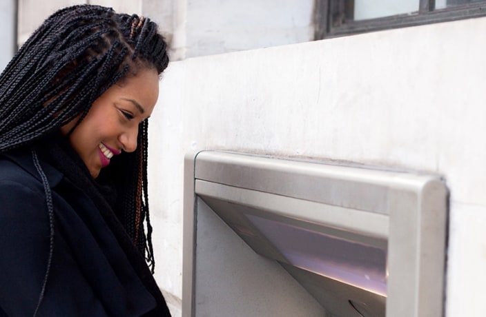 Photo of woman at an ATM