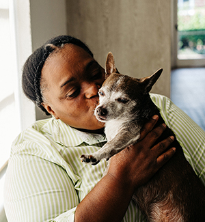 Woman holding her dog