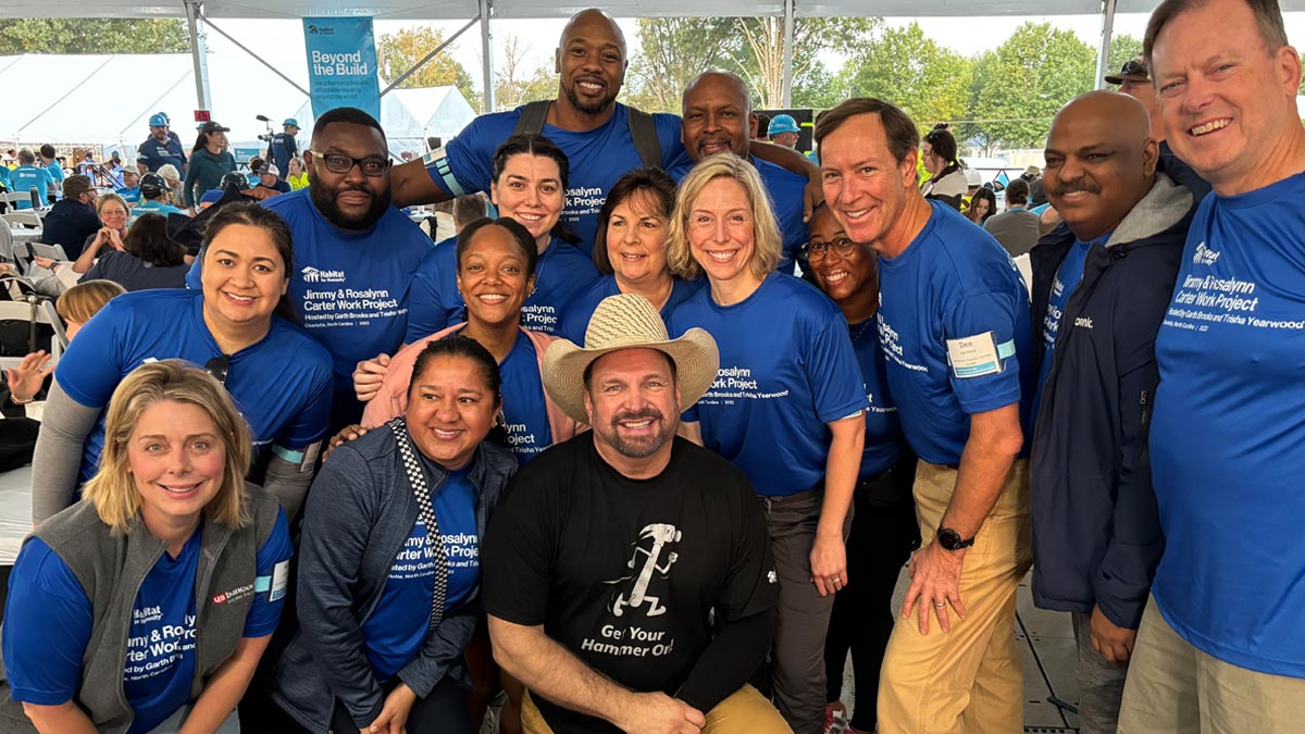 People posing with Garth Brooks