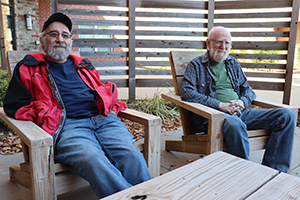 Two men sitting together in chairs