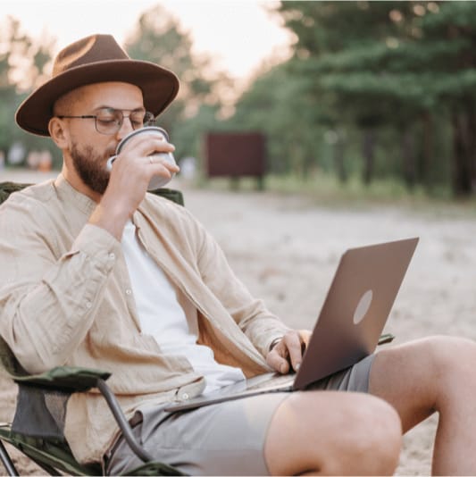 man searching RV dealerships online with U.S. Bank