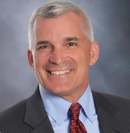 Headshot of Jim Palmer wearing a suit and tie