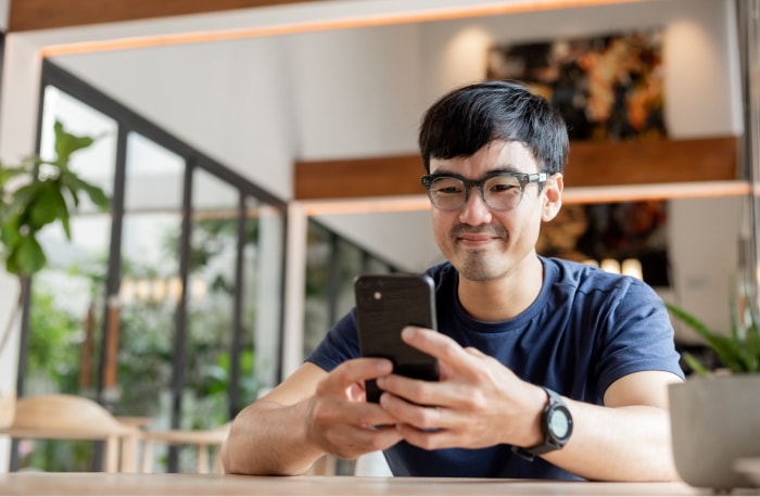 person at home using a smartphone