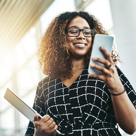 Woman using tablet smiling